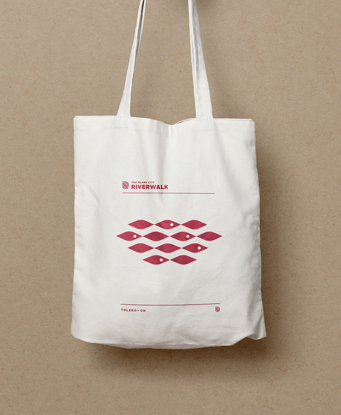 White tote bag with Glass City Riverwalk branding 