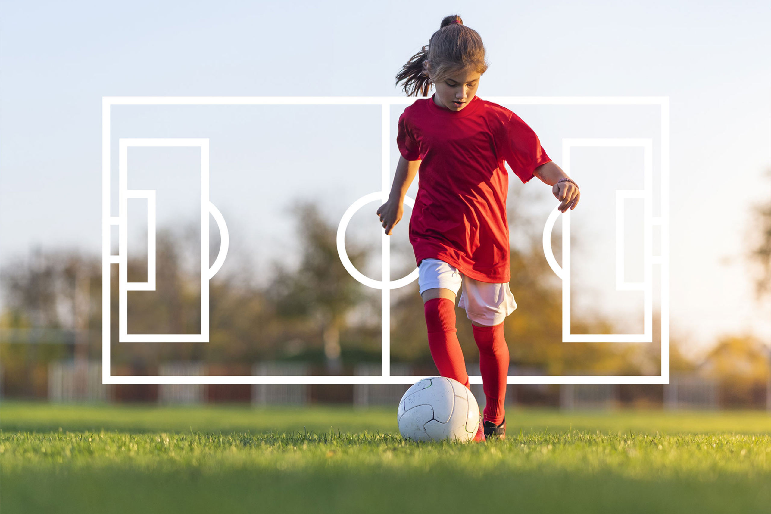 Little girl playing soccer in a red uniform with outline of soccer field behind her